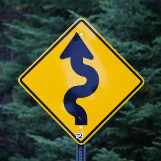 yellow and black arrow sign by Mark König courtesy of Unsplash.
